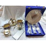 A crate containing a chamber candlestick, cased set of Indian silver plated goblets and gallery