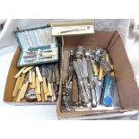 A box containing a quantity of silver plated cutlery, knife rests, elephant figurine, etc.
