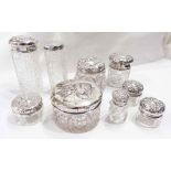 A small collection of silver topped dres A small collection of silver topped cut glass dressing