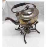 A large silver plated spirit kettle of semi-reeded oval design, set on a cast base with burner