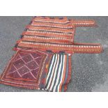 A tribal saddle bag with repeat pattern and hot orange detail - sold with a vintage hand made wool