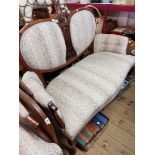 An Edwardian mahogany part show frame salon suite comprising settee and elbow chair, both with