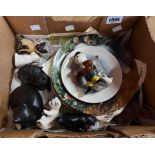 A small box containing two collectors' plates, cat figurines and a Poole Pottery cat plate