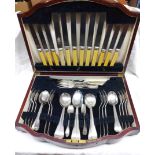 A 20th Century mahogany canteen containing a part suite of silver plated cutlery