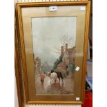 J.W. Gozzard: a gilt framed coloured print on textured paper, depicting a village street scene
