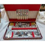 A vintage canteen containing a part set of stainless steel cutlery