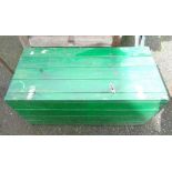 A green painted lift-top wooden trunk