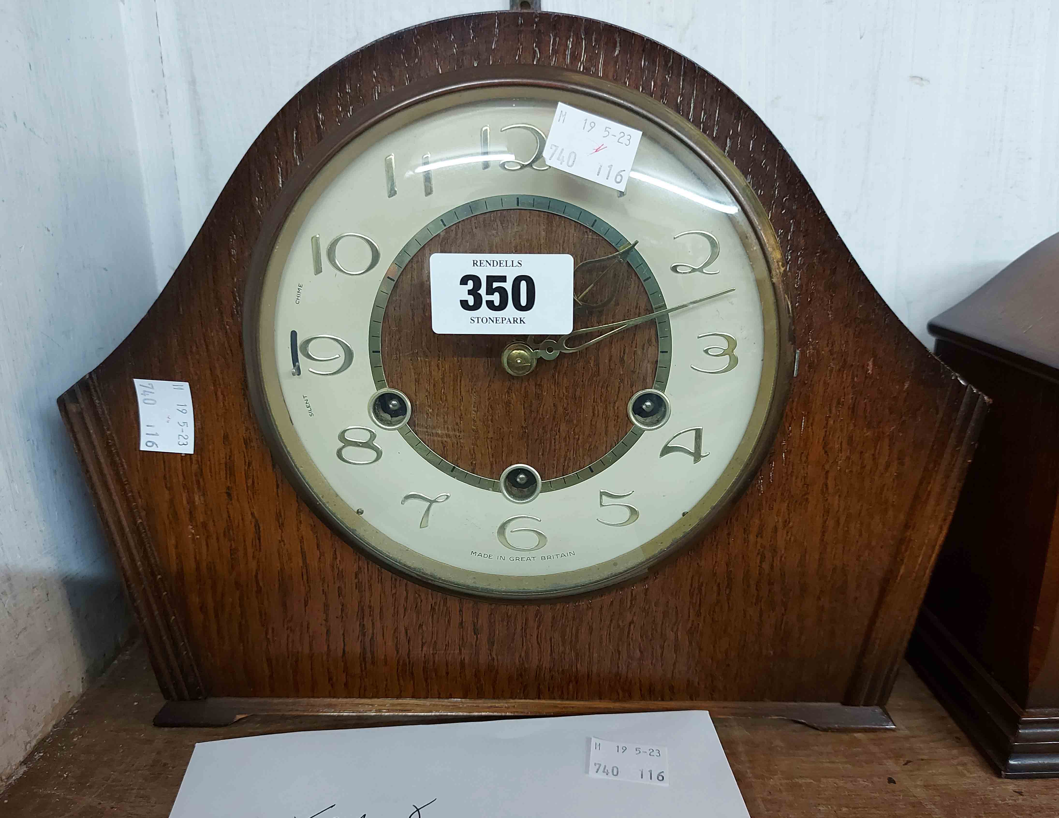 A vintage Smiths stained oak cased mantel clock with eight day chiming movement