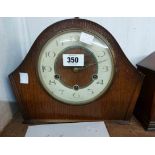 A vintage Smiths stained oak cased mantel clock with eight day chiming movement