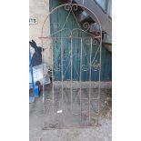 An 81cm wrought iron garden gate with dome-top and scroll decoration
