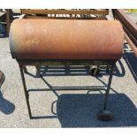 A barrel style barbecue with hinged lid