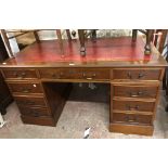 A 1.37m modern yew twin pedestal desk with red leather inset top, three frieze drawers and five