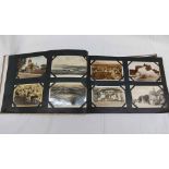 A large album containing a collection of early 20th Century and other postcards including,