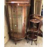 A vintage mahogany bow front display cabinet with glass shelves, set on cabriole legs - sold with