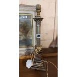 An old silver plated table lamp of corinthian column form