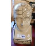 A modern ceramic phrenology head with crackle glaze finish