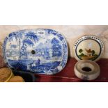 A 19th Century blue and white transfer printed strainer with a scene depicting a country house