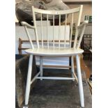 An Ercol style white painted stick back elbow chair