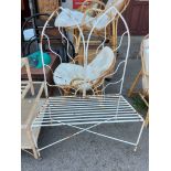 An 88cm white painted wrought metal two seater bench with Gothic arch back and stylised sunburst