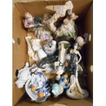 A box containing a quantity of resin and porcelain figurines