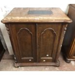 A 70cm Victorian stained mixed wood two door cabinet with internal drawers to one side, set on