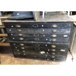 A 1.24m early 20th Century stained pine and oak two part plan chest with flight of eight drawers and