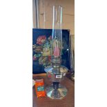 A vintage Aladdin oil lamp with chrome plated reservoir and clear glass shade - sold with an extra