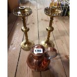A pair of cast brass candlesticks in the Gothic style - sold with a copper Jersey milk can