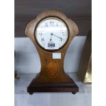 An Edwardian inlaid mahogany cased timepiece with fan shaped top and platform escapement to simple