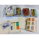 Four plastic tubs containing a collection of mainly vintage postcards - sold with a small quantity