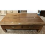 A 1.03m vintage stained mixed hardwood coffee table with flush brass handles to the two frieze