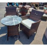 A Chelsea Garden Furniture set comprising two chairs and table in woven brown plastic with white