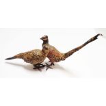 An Austrian cold painted figurine depicting a cock and hen pheasant