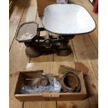 A box containing a set of cast iron scales with enamel pan and graduated cast iron weights - sold