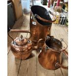 A copper coal scuttle of hod form, a copper milk jug and a similar kettle