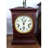 A reproduction mahogany cased table clock by Sewills of Liverpool with eight day triple chiming