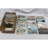 A shoe box containing a collection of 20th Century postcards including topographic, named views,