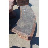 A Chinese style concrete curved garden bench, set on standard ends