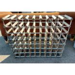 A galvanised metal framed sixty-three bottle wine rack with wooden dividers