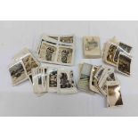 A small collection of monochrome photographic cigarette cards comprising large format