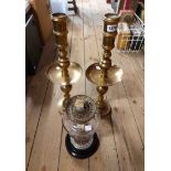 A pair of large 20th Century spun brass candlesticks with central drip trays in the antique
