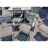 Five matching teak slatted folding garden elbow chairs with metal frames