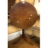 A 62cm diameter mahogany tilt-top pedestal table, set on turned pillar and tripod base