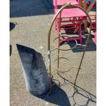 A vintage metal three tier plant stand and a coal scuttle