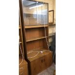 An 81cm vintage G-Plan teak effect wall unit with glass sliding doors, open shelf and pair of