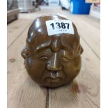 A modern cast brass Oriental four sided head