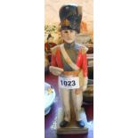 A ceramic spirit flask in the form of a 19th Century soldier
