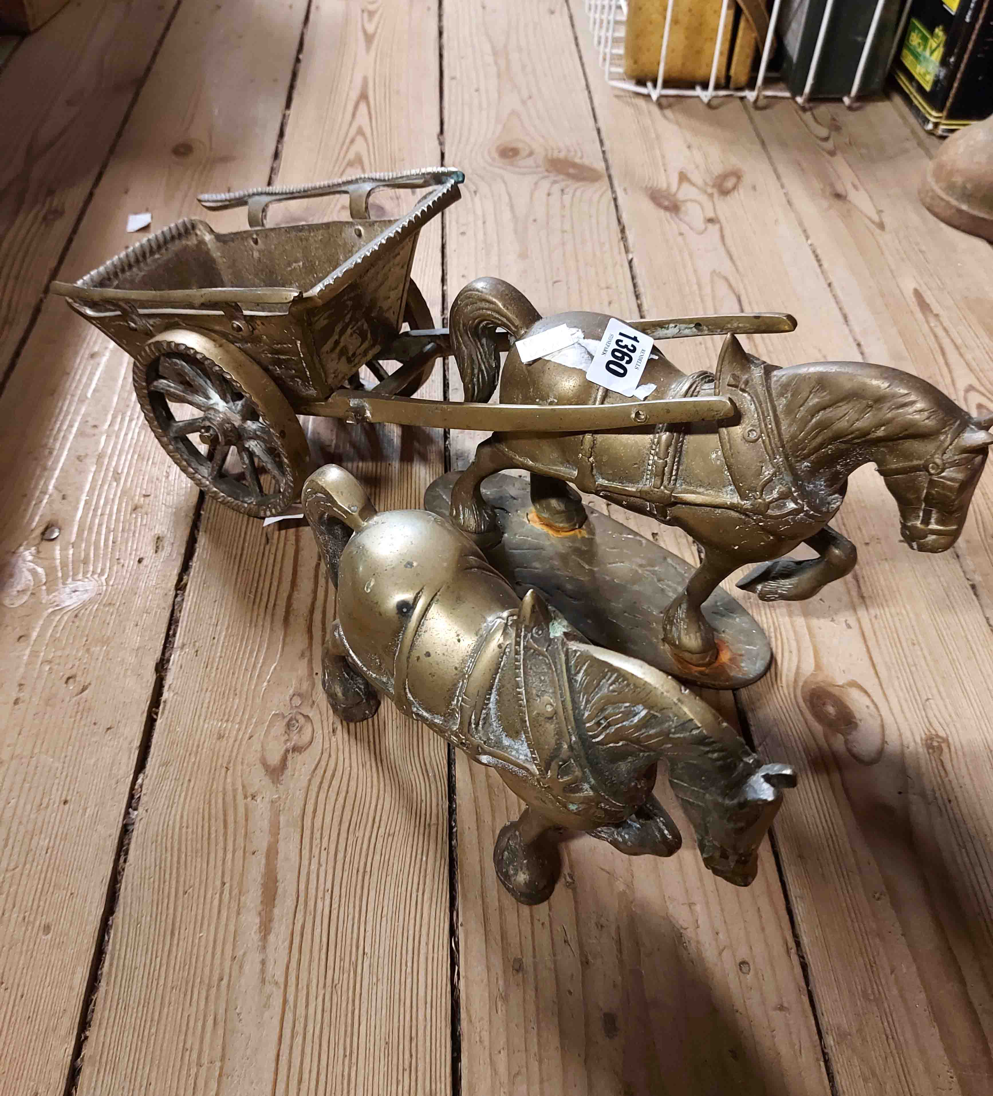 A cast brass model of a horse and cart - sold with a similar cart horse figurine