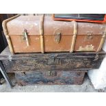 Three painted tin travelling trunks - sold with another with canvas weather coating - various
