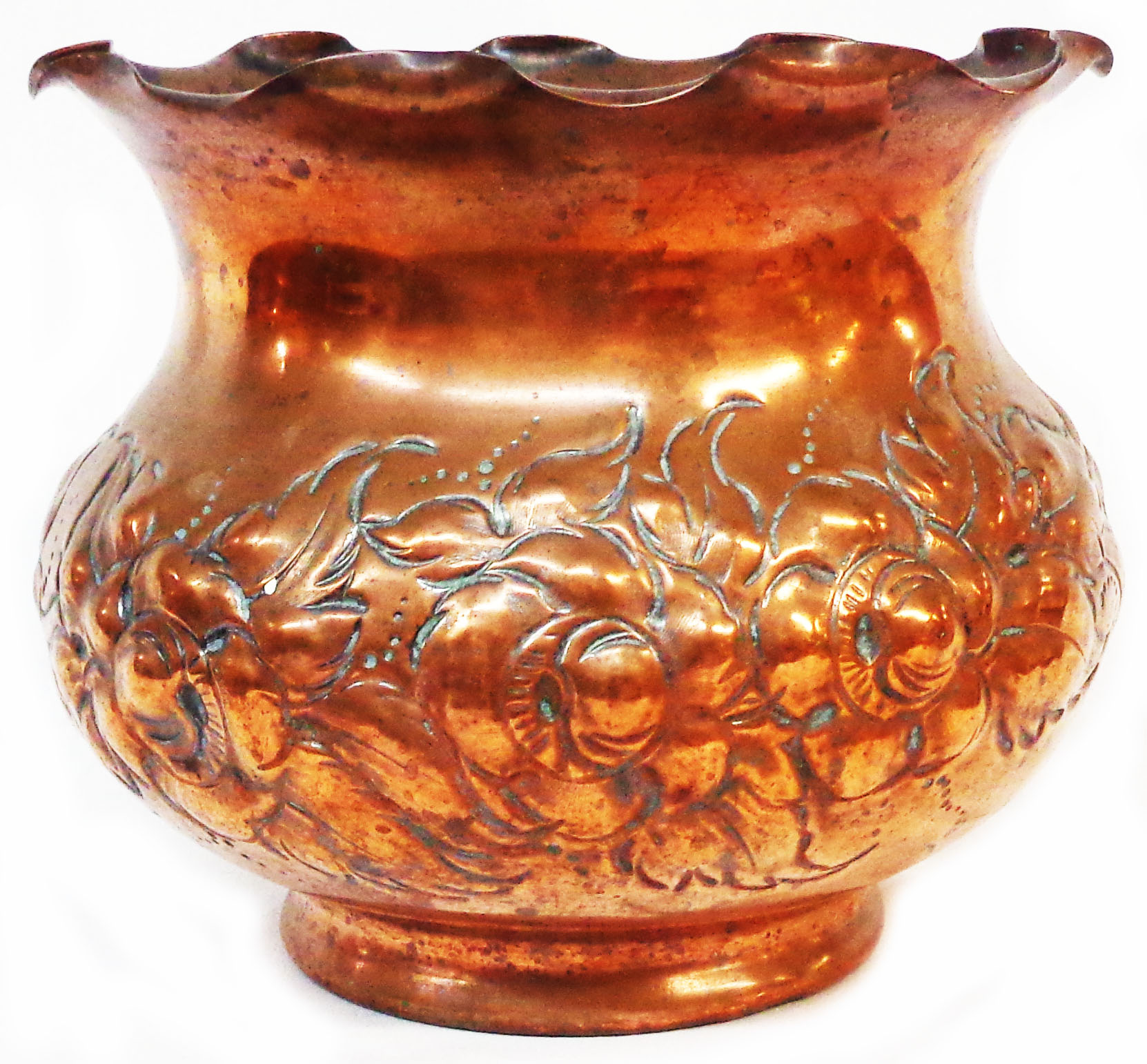 A 19th Century copper jardiniere with repousse decoration depicting thistles, shamrock and roses
